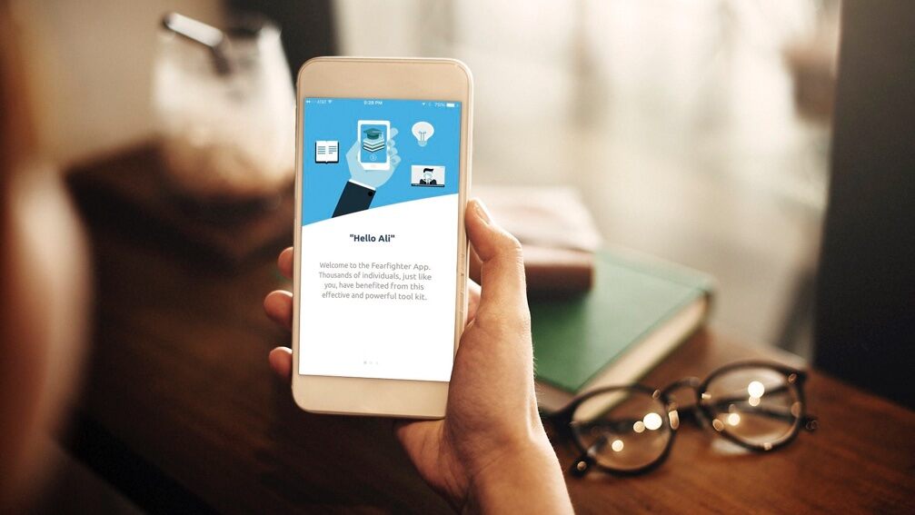 A mobile device with the on-screen message that says, “Hi, Ali”